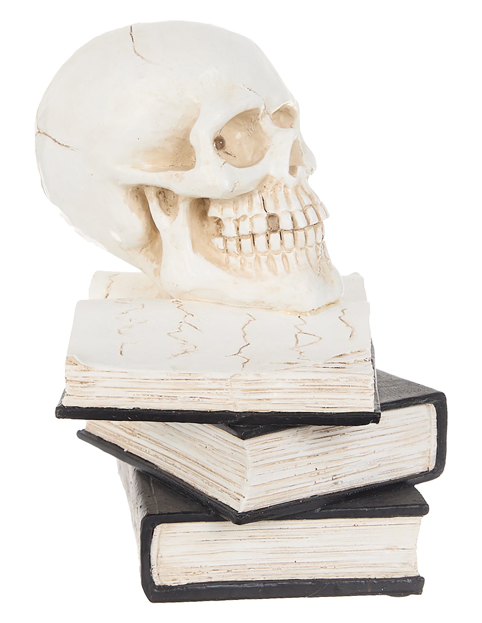 Figura decorativa de Halloween con forma de cráneo sobre libros 2