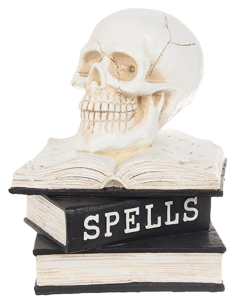 Figura decorativa de Halloween con forma de cráneo sobre libros 4