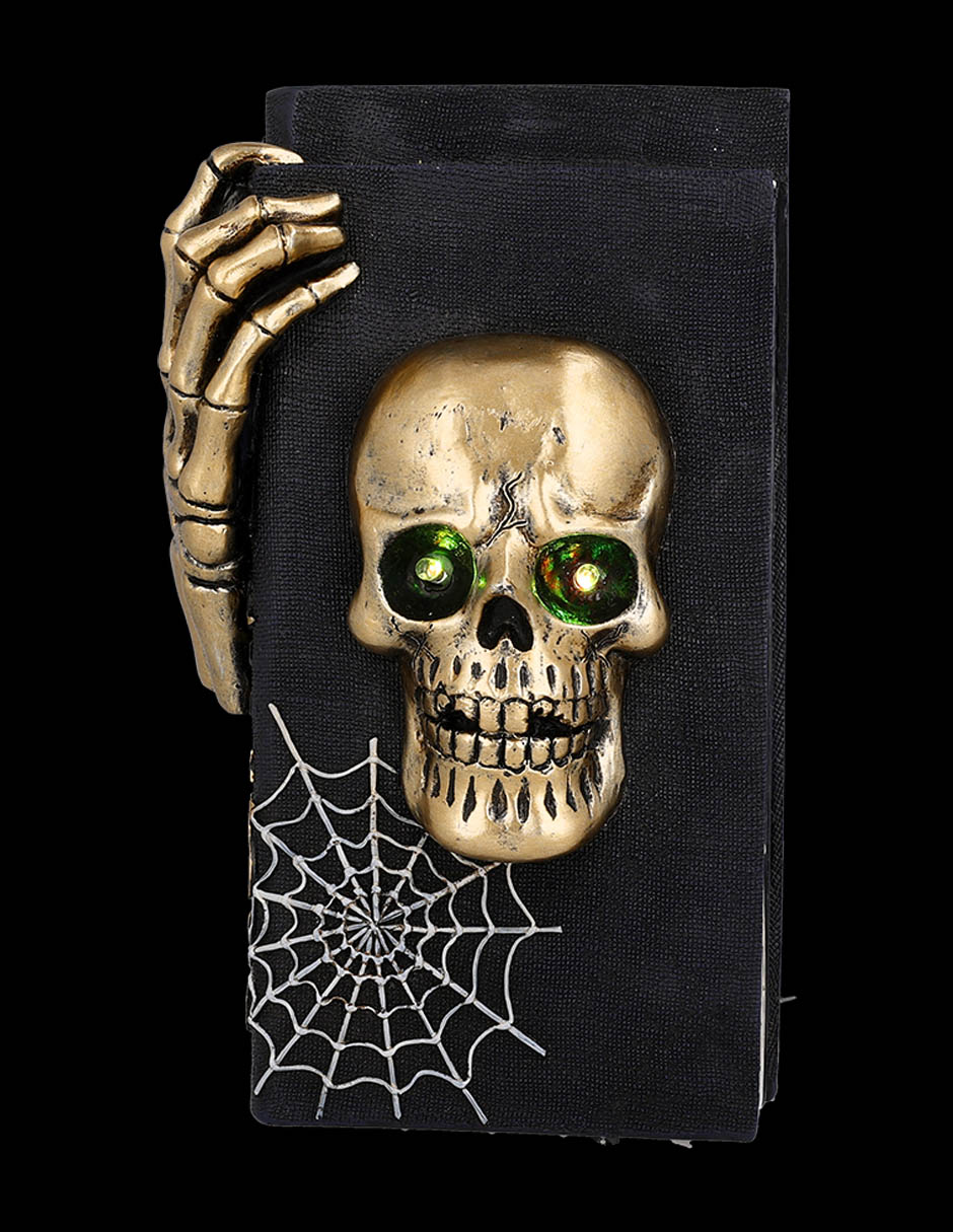 Figura decorativa de Halloween con forma de cráneo sobre libros 6
