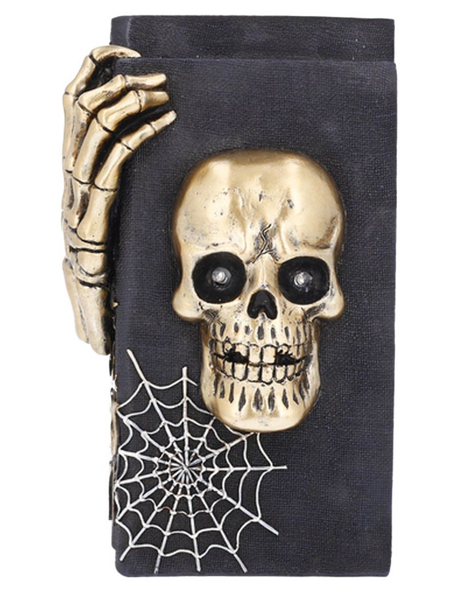 Figura decorativa de Halloween con forma de cráneo sobre libros 1