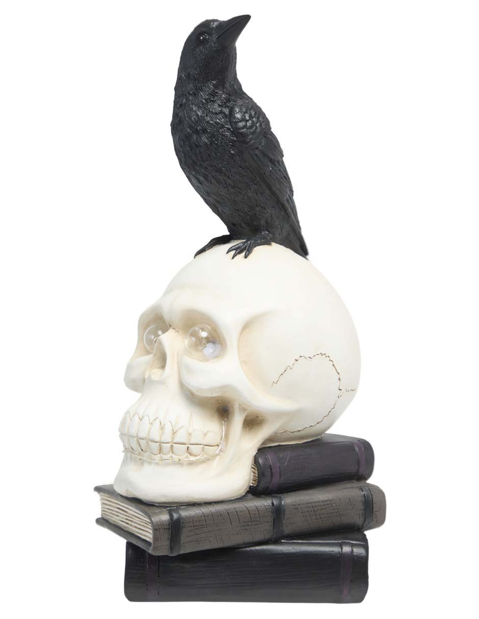 Figura decorativa de Halloween con forma de cráneo sobre libros 2