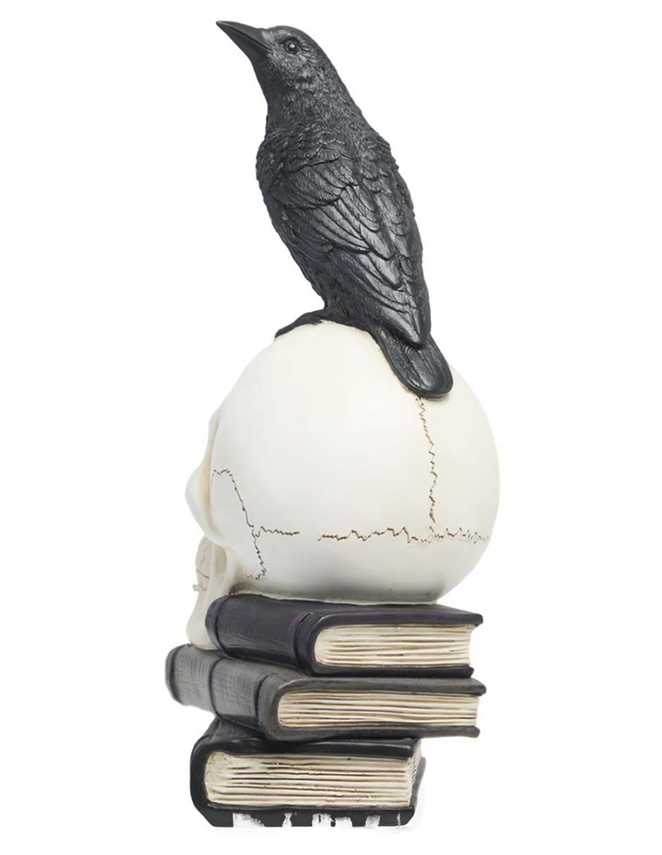 Figura decorativa de Halloween con forma de cráneo sobre libros 4