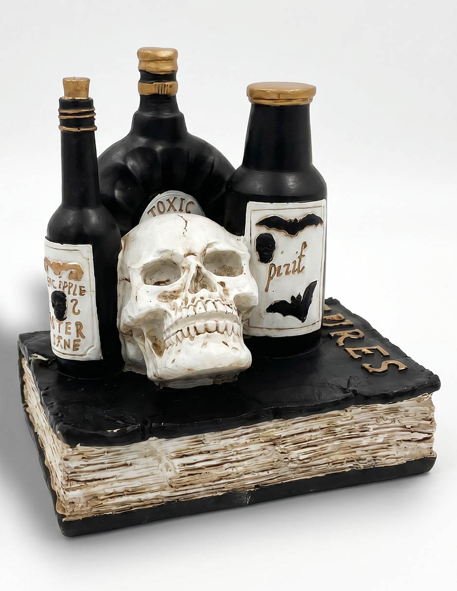 Figura decorativa de Día de muertos con forma cráneo sobre libro 2
