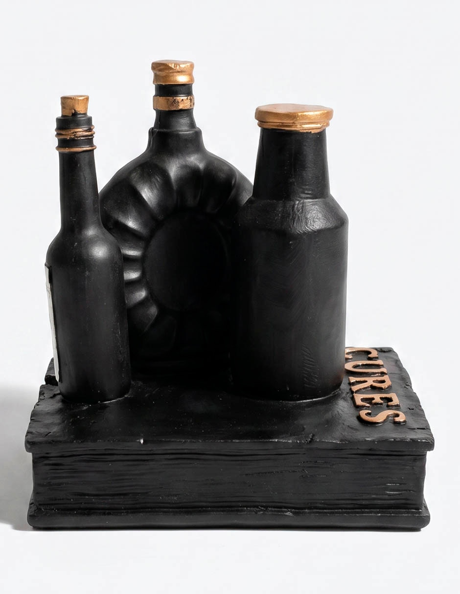 Figura decorativa de Día de muertos con forma cráneo sobre libro